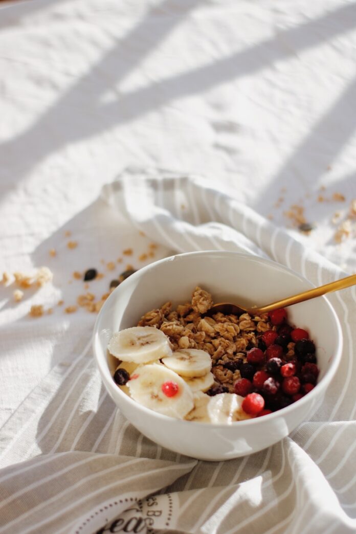 Photo by Nataliya Melnychuk white ceramic bowl with brown and white nuts