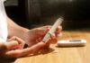 혈당 관리, 어렵지 않아요! 일상에서 실천하는 스마트 건강 팁 a person sitting at a table with a cell phone